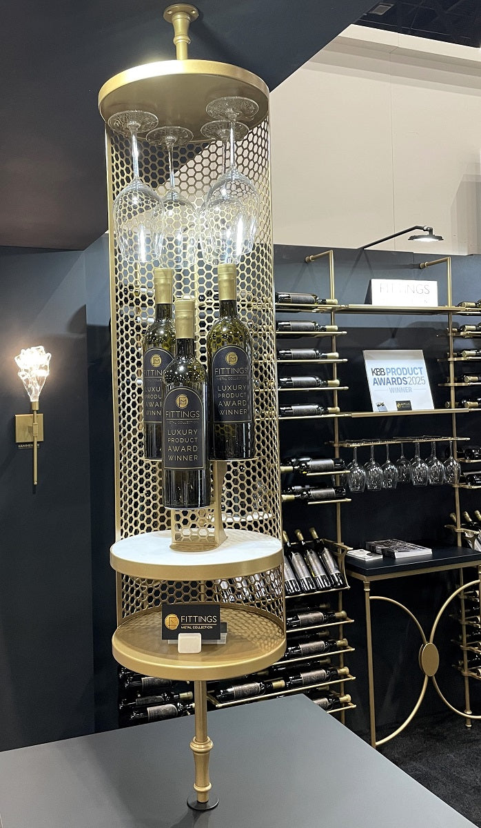 Round metal wine bottle display with integrated stemware holder in gold finish.
